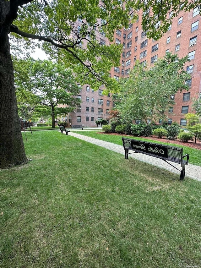 view of home's community featuring a lawn