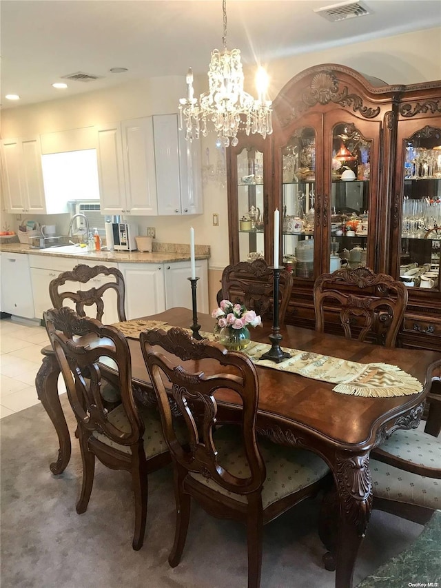 dining area featuring an inviting chandelier