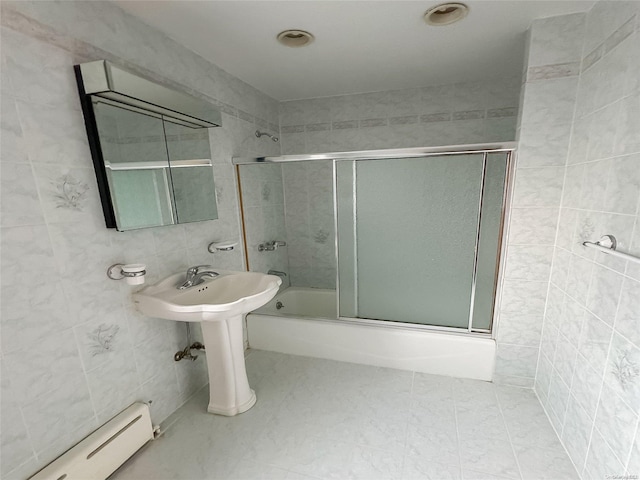 bathroom featuring a baseboard radiator, tile walls, and enclosed tub / shower combo