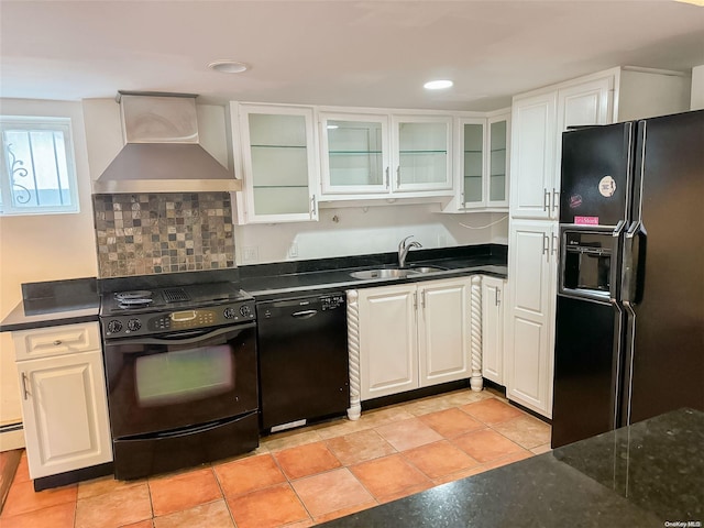 kitchen with white cabinets, sink, wall chimney exhaust hood, and black appliances