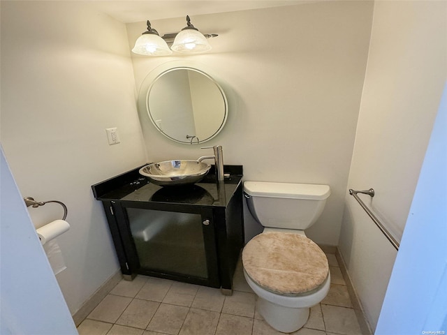 bathroom featuring tile patterned floors, vanity, and toilet