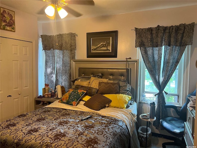 bedroom featuring ceiling fan and a closet