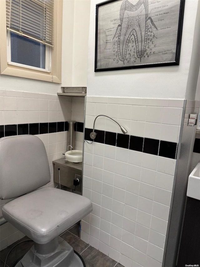 bathroom with tile walls