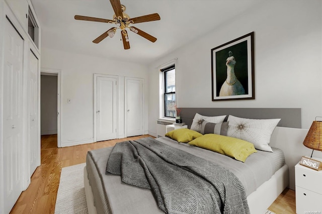 bedroom featuring light wood-style floors and ceiling fan