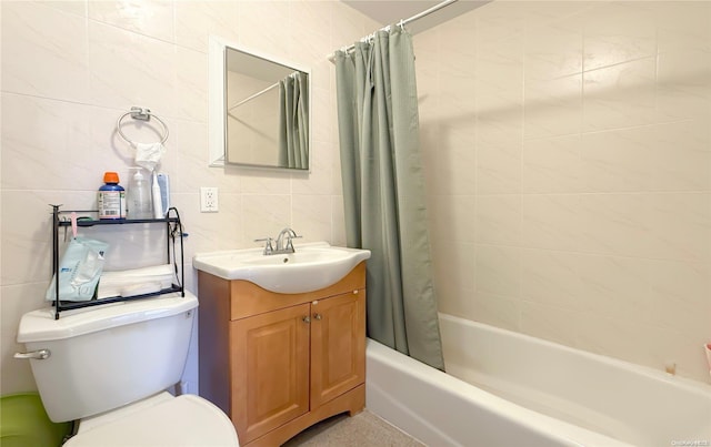 full bathroom with vanity, toilet, tile walls, and shower / tub combo with curtain