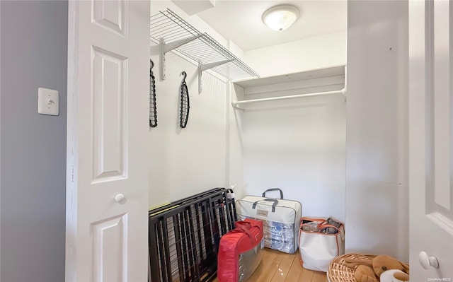 spacious closet featuring hardwood / wood-style floors