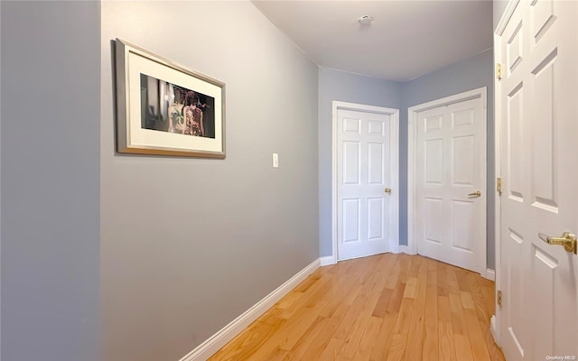 hall with light hardwood / wood-style floors