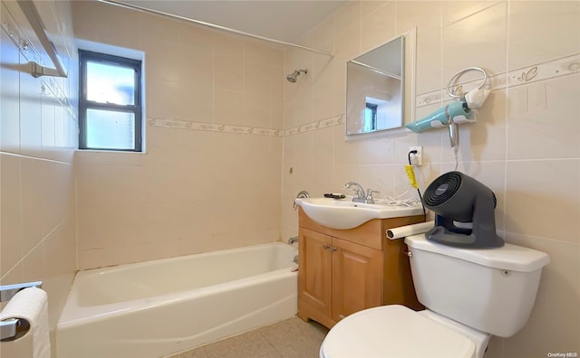 full bathroom featuring vanity, backsplash, tile patterned floors, toilet, and tile walls