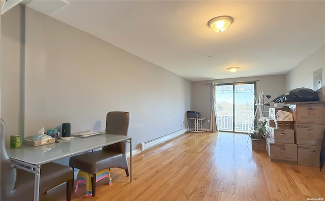 office with baseboard heating and light hardwood / wood-style floors