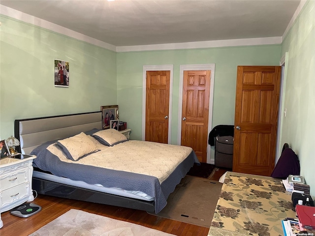 bedroom with hardwood / wood-style floors