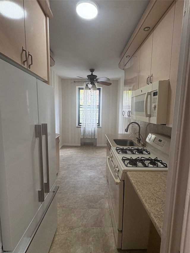 65-38 Booth St Unit 2F, Rego Park, NY 11374 - kitchen featuring white appliances, a sink, and ceiling fan