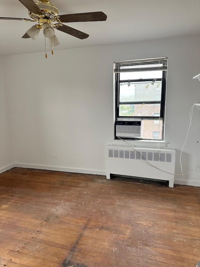 52-21 65th Pl Unit 6P, Maspeth, NY 11378 - unfurnished room with baseboards, ceiling fan, radiator heating unit, and hardwood / wood-style floors