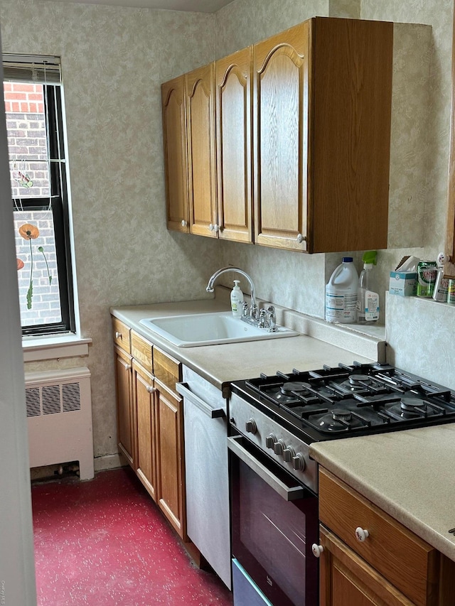 52-21 65th Pl Unit 6P, Maspeth, NY 11378 - kitchen featuring appliances with stainless steel finishes, a sink, light countertops, dark colored carpet, and radiator