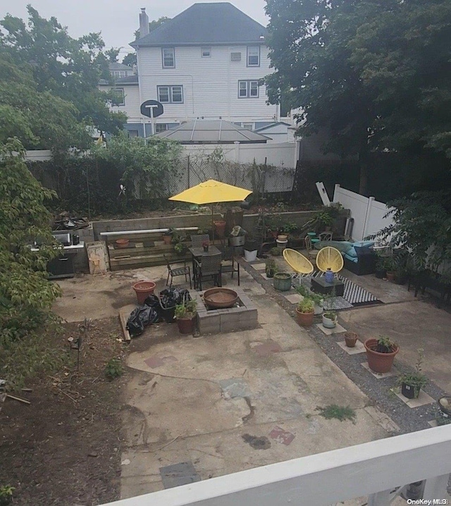 view of patio / terrace with an outdoor fire pit