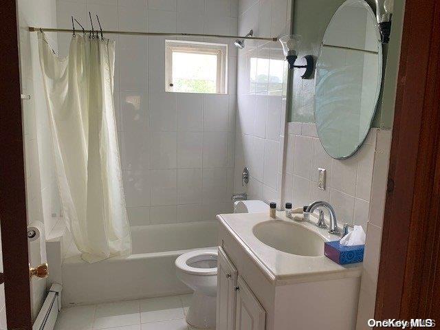 full bathroom featuring shower / tub combo, tile patterned floors, a baseboard heating unit, tile walls, and toilet