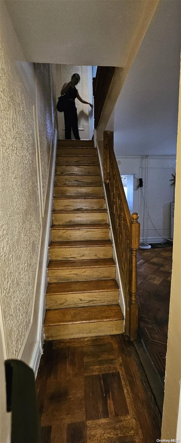 staircase with parquet flooring