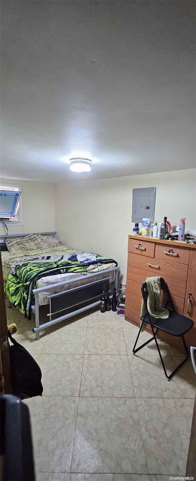 bedroom featuring light tile patterned flooring