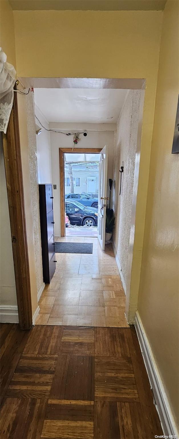 hallway featuring parquet floors