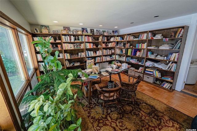 living area featuring parquet floors