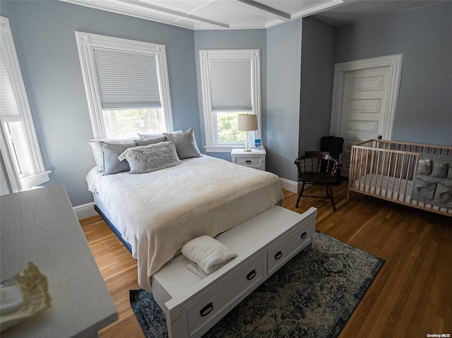 bedroom with hardwood / wood-style floors