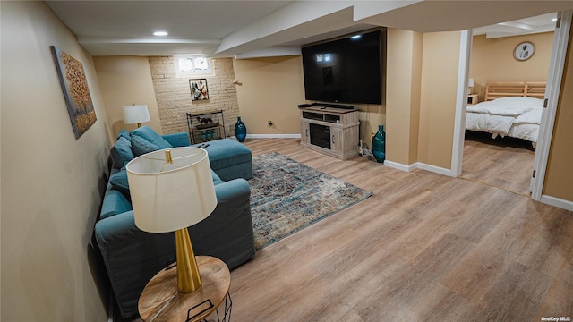 living room featuring a fireplace and light hardwood / wood-style flooring