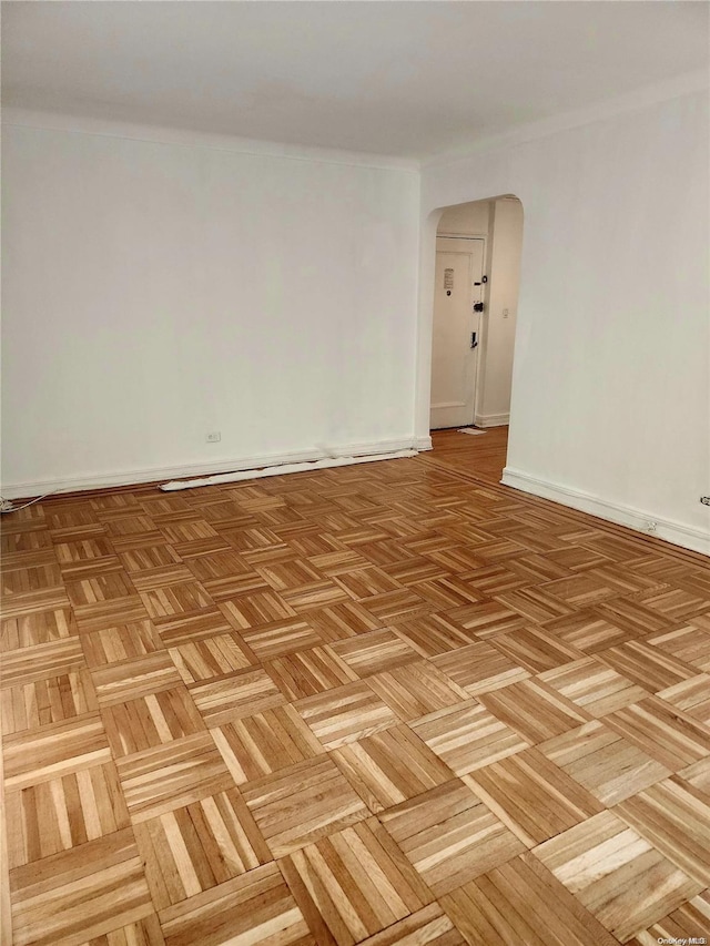 unfurnished room featuring light parquet floors