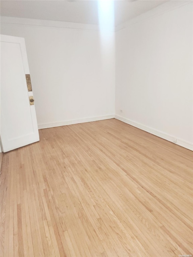 unfurnished room with light hardwood / wood-style flooring