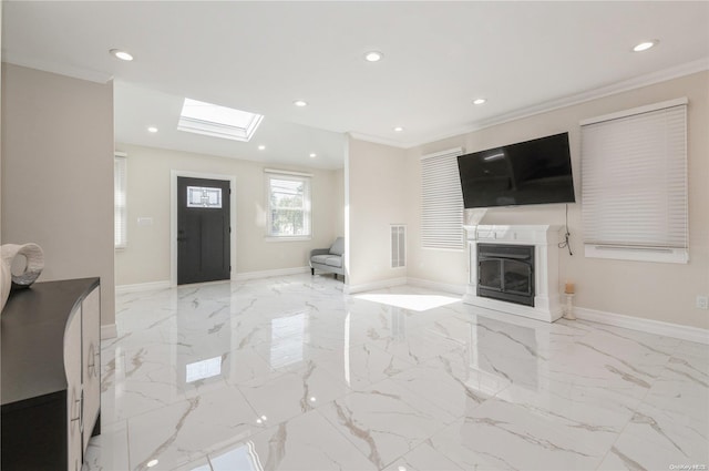 living room with a skylight and crown molding