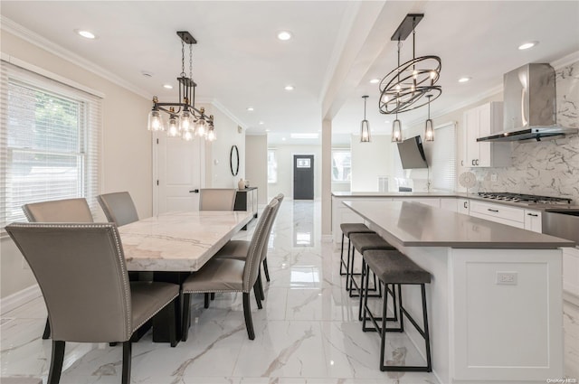 dining area featuring ornamental molding