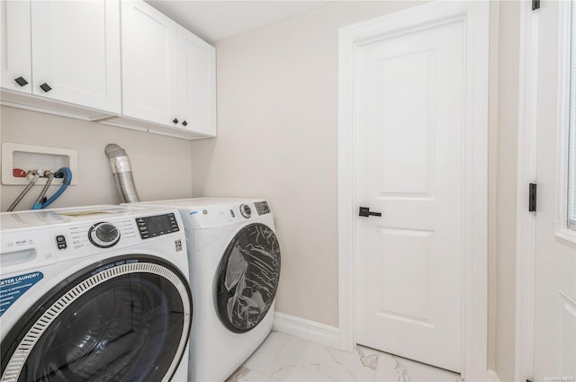 laundry area with cabinets and independent washer and dryer