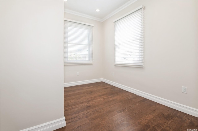 unfurnished room with dark hardwood / wood-style flooring and crown molding