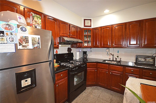 kitchen featuring black range with gas stovetop, stainless steel fridge with ice dispenser, backsplash, and sink