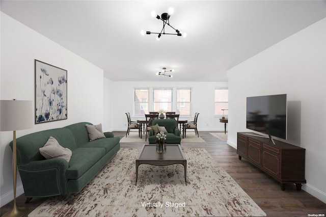 living room with a chandelier and hardwood / wood-style flooring