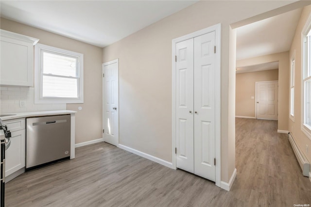 kitchen featuring dishwasher, a baseboard heating unit, decorative backsplash, white cabinets, and light wood-type flooring