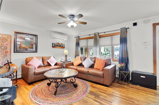 living room with a wall mounted air conditioner, light hardwood / wood-style floors, ceiling fan, and crown molding