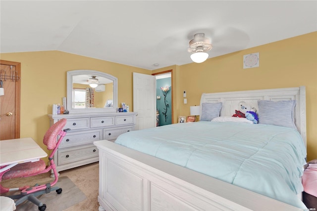 bedroom featuring light carpet, ceiling fan, and lofted ceiling