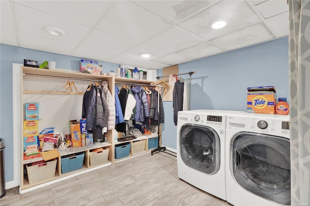 washroom featuring independent washer and dryer and light hardwood / wood-style floors