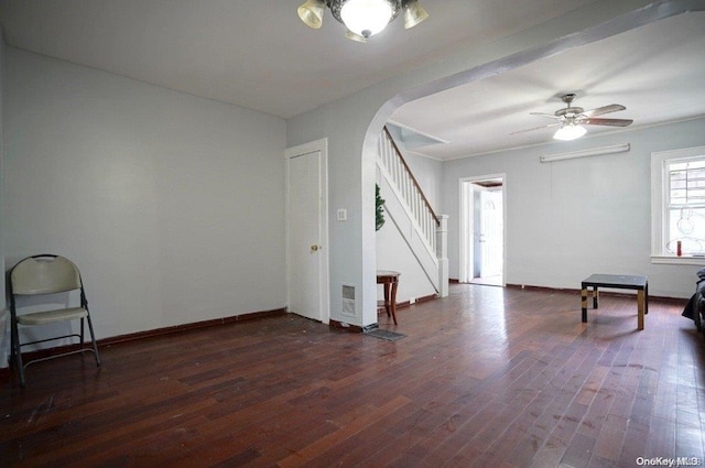 spare room featuring ceiling fan and dark wood-type flooring