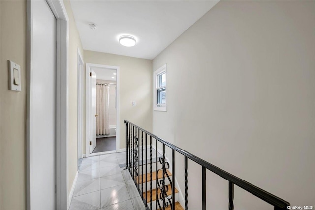 corridor with light tile patterned floors