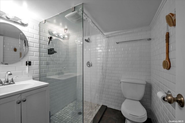 bathroom featuring vanity, a shower with door, crown molding, tile walls, and toilet