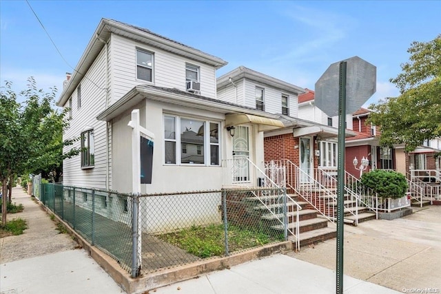 view of front of property featuring cooling unit