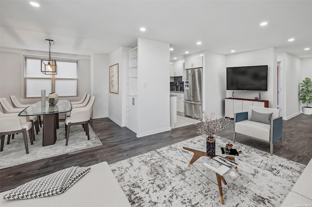 living room featuring dark wood-type flooring