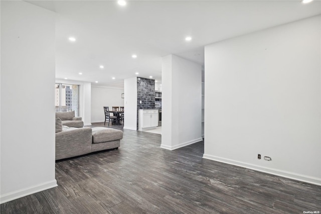 unfurnished living room featuring dark hardwood / wood-style flooring