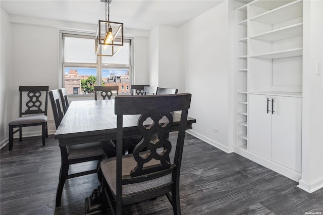 dining room featuring a chandelier and dark hardwood / wood-style flooring