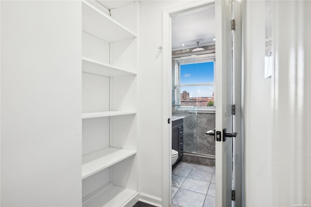 spacious closet featuring tile patterned floors