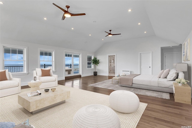 living room featuring ceiling fan, lofted ceiling, and dark wood-type flooring