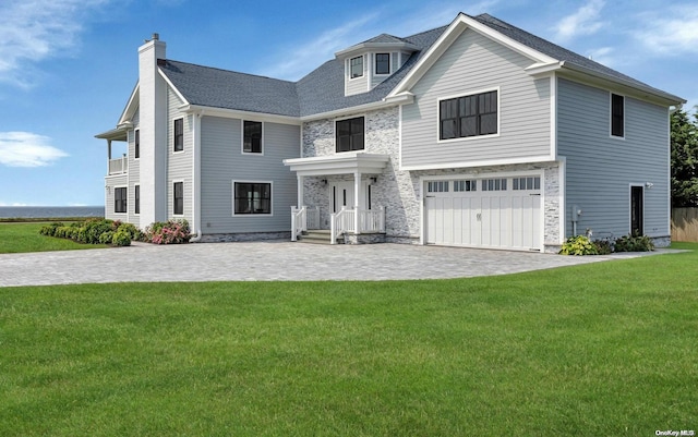 view of front of house with a garage and a front yard