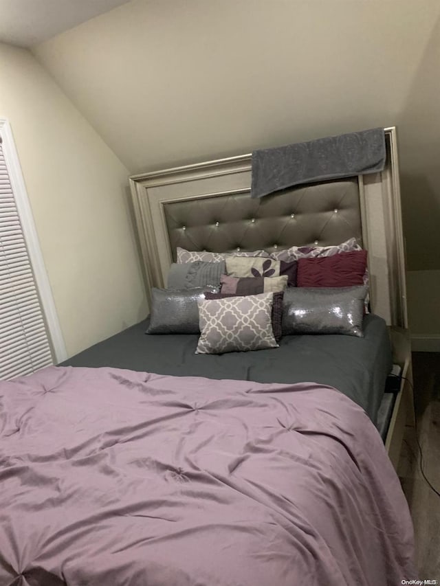 bedroom with lofted ceiling