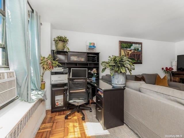 office space featuring light parquet floors and radiator