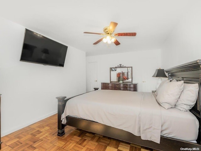 bedroom featuring ceiling fan and light parquet flooring